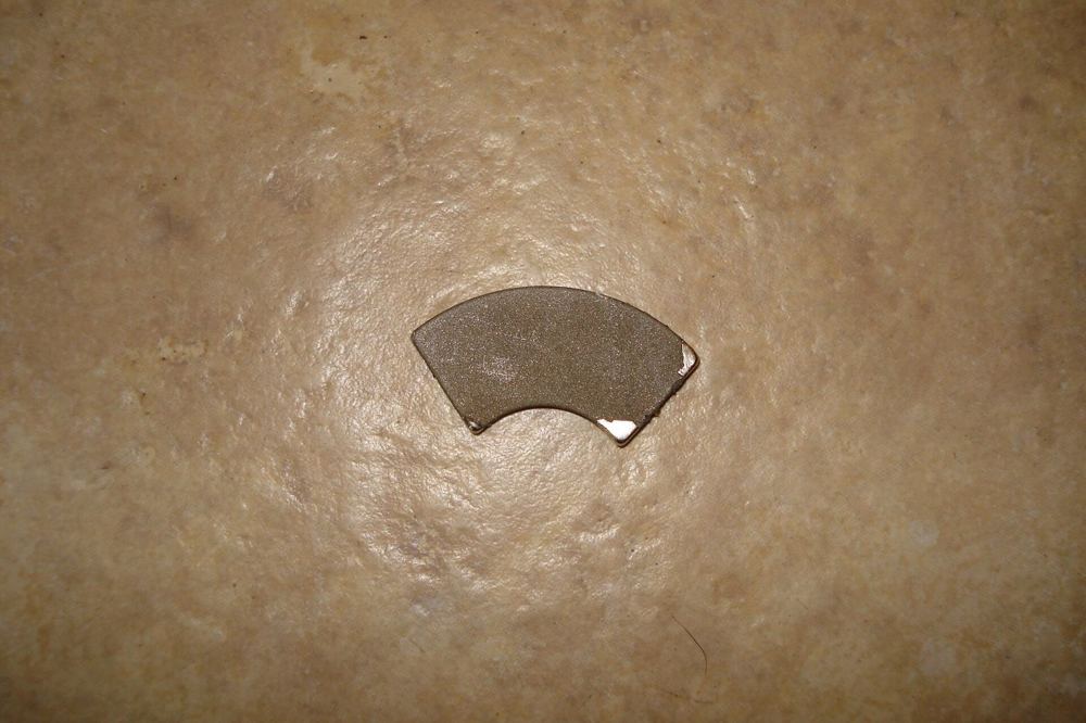 Arc-segment neodymium magnet of the kind used in motor rotors