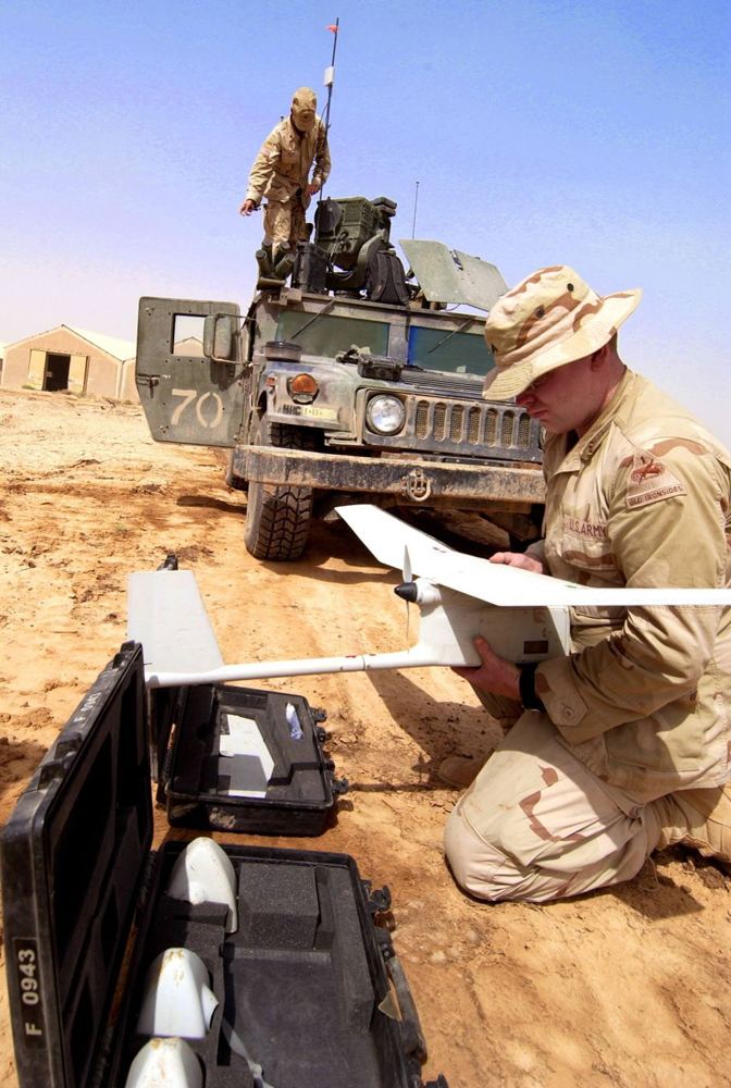A soldier assembles an RQ-11 Raven before a mission